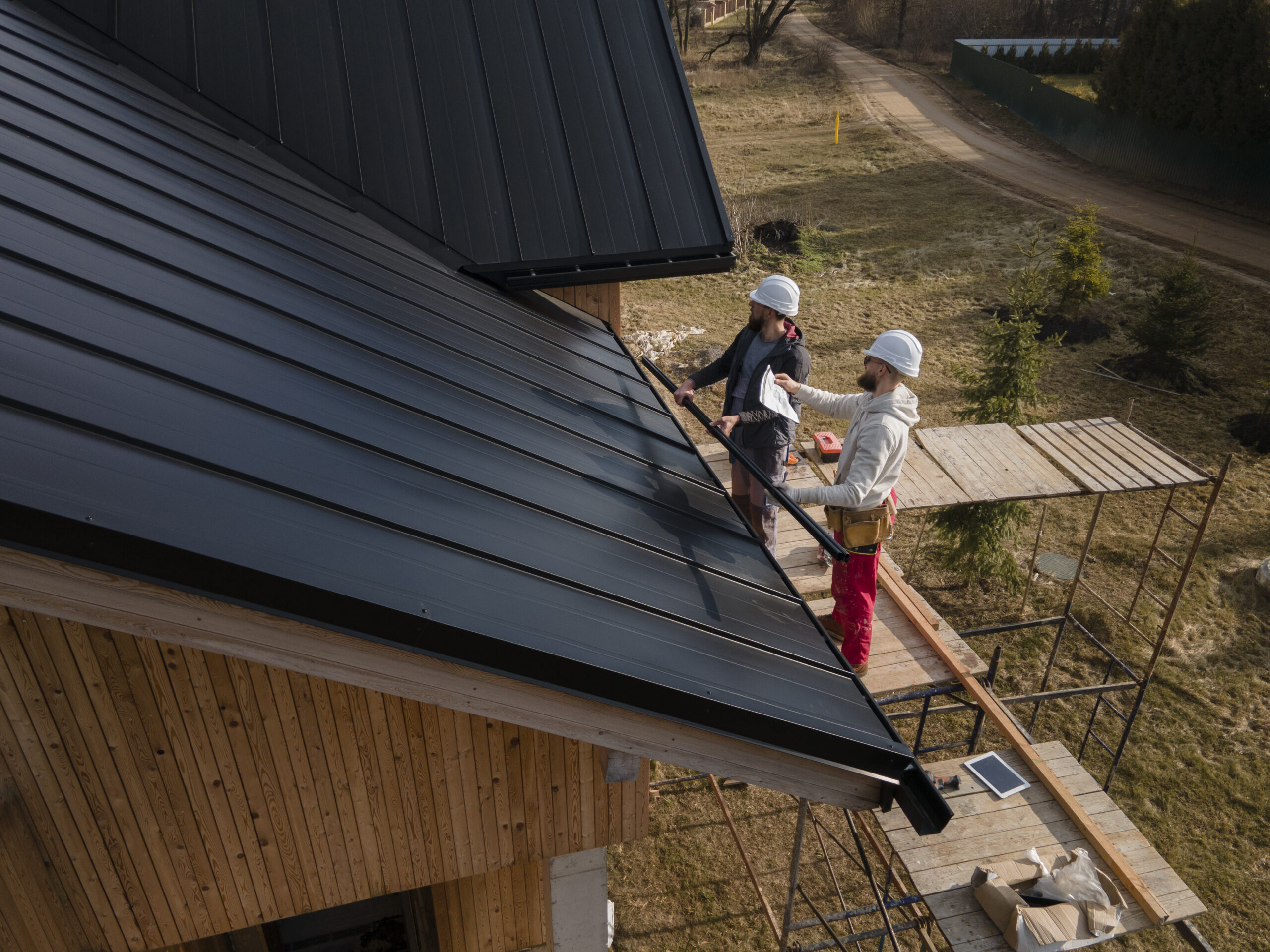 full-shot-roofers-working-with-helmets